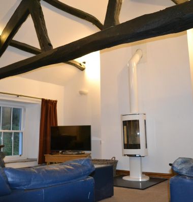 Upstairs sitting room with wood burning stove