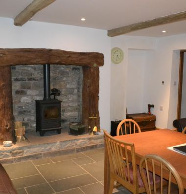 Dining area and wood burning stove.